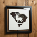 South Carolina pheasant feather art with deer silhouette on rustic wood background